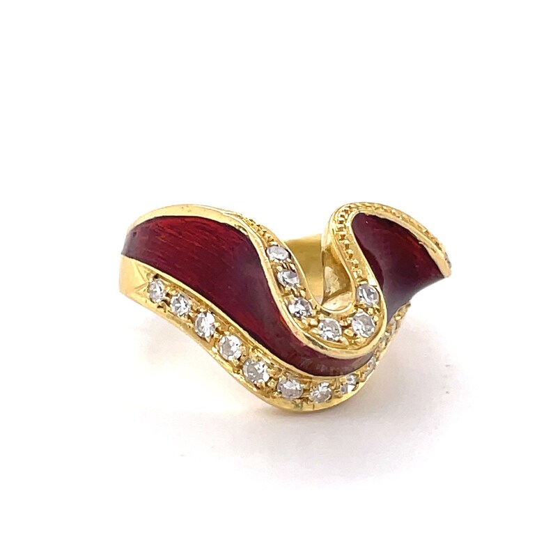 May include: A gold ring with a red enamel band and a row of clear stones around the band.