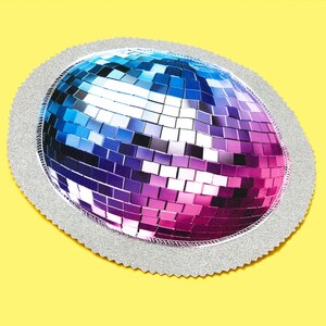 May include: A circular decorative item with a disco ball design. The disco ball is rendered in shades of blue, purple, and pink, with a silver glitter border. The item is set against a bright yellow background.