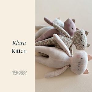 May include: A collection of soft fabric kitten dolls in various colours and patterns, including a floral print, solid beige, and muted mauve. The text Klara Kitten and ME & KIDDO PATTERNS is displayed on the left side of the image in dark grey.