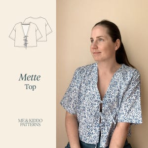 May include: A short-sleeved top with a white and blue floral pattern, featuring a V-neckline with three tie closures down the front. The image includes a technical line drawing of the garment and the text Mette Top ME & KIDDO PATTERNS.