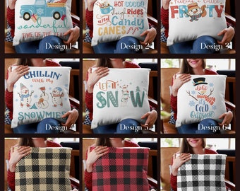May include: Nine different designs for throw pillows featuring winter and holiday themes. The designs include a truck with presents, a snowman, a plaid pattern, and text such as "It's the most wonderful time of the year", "Let it snow", and "Feeling a little frosty".
