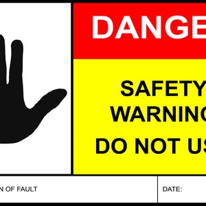 May include: A yellow and red safety warning sign with a black handprint and the text "DANGER SAFETY WARNING DO NOT USE".