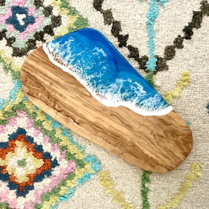 Ocean art cheese board made of olive wood. Resin ocean charcuterie board for beach lover gift.