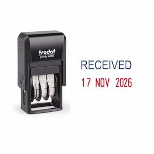 May include: Black Trodat printy 4850 date stamp with a white date wheel. The stamp reads "RECEIVED 17 NOV 2026".