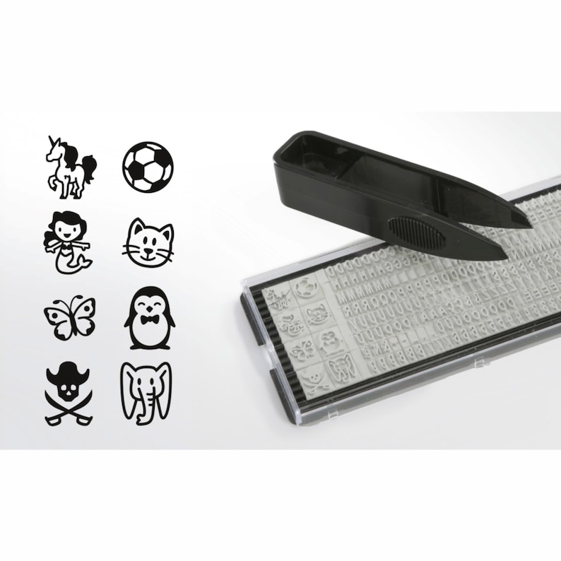 May include: A black plastic stamp with a variety of alphabet letters, numbers, and symbols. The stamp also includes a set of small, black and white images, including a unicorn, a soccer ball, a mermaid, a cat, a butterfly, a penguin, a pirate skull and crossbones, and an elephant. A black plastic tool with a handle and two prongs is used to select the desired stamp.