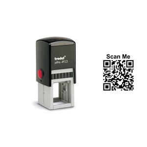 May include: Black and grey self-inking stamp with the text "trodat printy 4923" and a red button. A black and white QR code with the text "Scan Me" is to the right of the stamp.