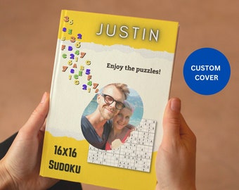 May include: A yellow book with a photo of a couple on the cover. The book is titled "JUSTIN" and says "Enjoy the puzzles!" The book is a 16x16 Sudoku puzzle book with a custom cover.