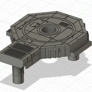 Op de afbeelding: Een grijze, achthoekige basis met drie poten en een centrale opening. De basis heeft een getextureerd oppervlak en lijkt van plastic te zijn.