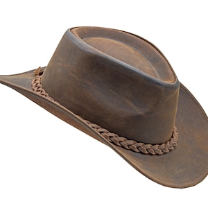 May include: A brown leather cowboy hat with a braided leather band.