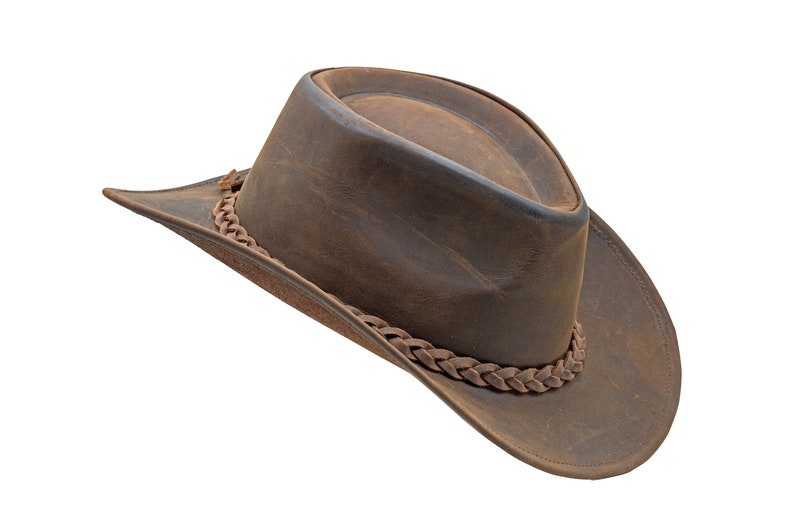 May include: A brown leather cowboy hat with a braided leather band.