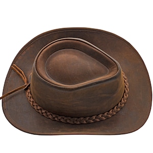 May include: A brown leather cowboy hat with a braided band.