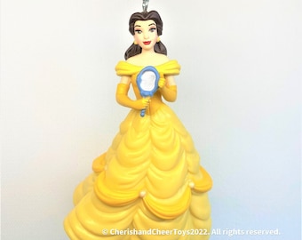 belle blue dress ornament Beauty and the Beast Princess Christmas From Disney, Belle Ornament, Princess Belle Ornament, Belle Princess Ornament, Belle addprice10 This ornament is a Asymmetrical purple dress with Color:Black/Lilac Multi