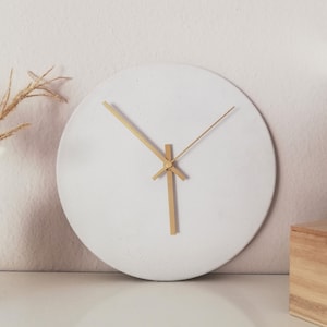 Wall clock made of white concrete, hands color selectable