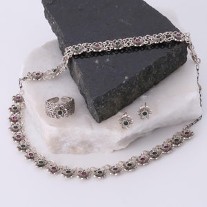 Handcrafted Silver Jewelry Set with Green and Magenta Stones Featuring Floral Necklace Bracelet Ring and Stud Earrings Design