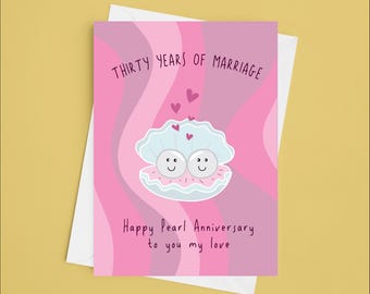 May include: A pink and purple card with a swirl pattern. The card says "Thirty Years of Marriage" and "Happy Pearl Anniversary to you my love". There are two pearl-like objects with faces inside a shell.