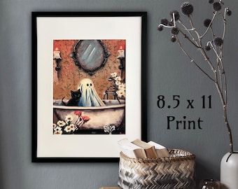 May include: A framed print featuring a whimsical illustration of a ghost in a bathtub with a black cat. The artwork includes a mirror, candles, and flowers. The print measures 8.5 x 11 inches.