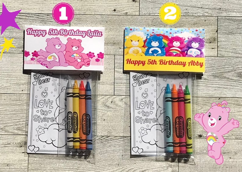 May include: Two Care Bear themed birthday party favor bags. Each bag contains a coloring page featuring a Care Bear and the text "Share Bear Love to Share" and four Crayola crayons. The top of each bag has a personalized message, one says "Happy 5th Birthday Laila" and the other says "Happy 5th Birthday Abby".