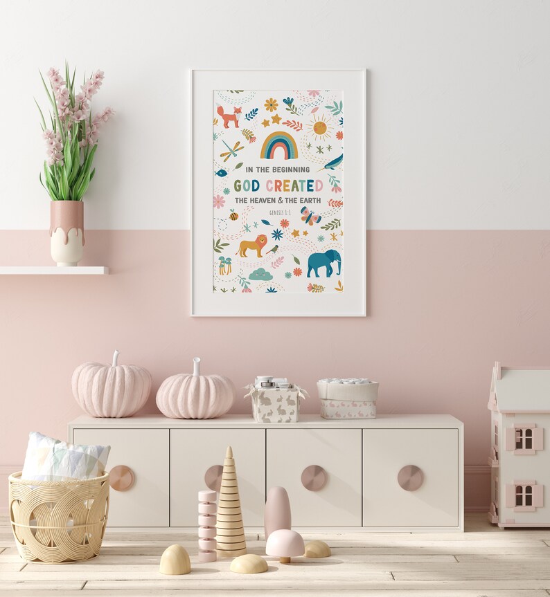 May include: A white framed print with a colorful illustration of animals, plants, and a rainbow. The text reads "In the beginning God created the heaven and the earth, Genesis 1:1".