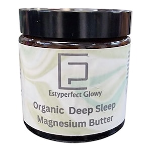 May include: A white jar with a black lid and a label that reads "Estypeerfect Glowy Organic Deep Sleep Magnesium Butter".