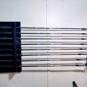 Wooden golf club wall display-grip side. Wall or floor mounting
