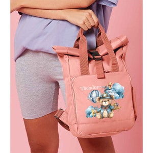 Adorable et pratique sac à langer pour petits garçons avec un joli motif d'ours en peluche, parfait pour transporter l'essentiel à la crèche ou lors de sorties.