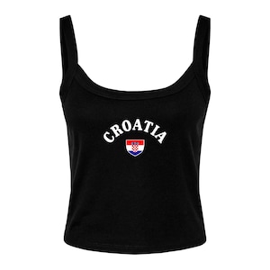May include: Black tank top with wide straps. The word "CROATIA" is printed in white arched text across the chest, with the Croatian coat of arms below the text. The top is a cropped style.