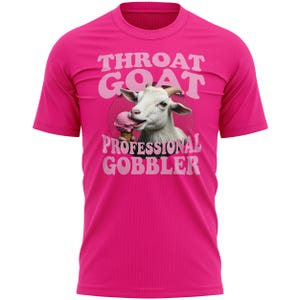 May include: A vibrant pink t-shirt with a graphic of a white goat enjoying ice cream. The text on the shirt says "THROAT GOAT" above the goat and "PROFESSIONAL GOBBLER" below.