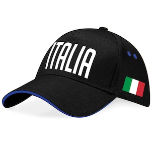 May include: Black baseball cap with the word "ITALIA" in white block letters. The cap has a blue brim and the Italian flag on the side.