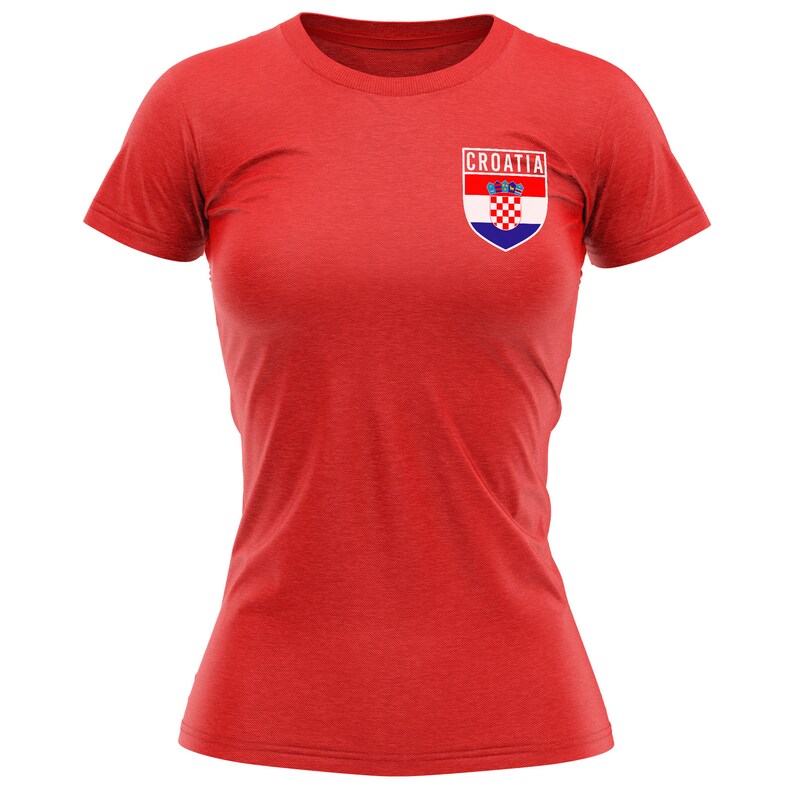 May include: Red t-shirt with a white and blue Croatian flag patch on the left chest. The patch has the word "CROATIA" above the flag.