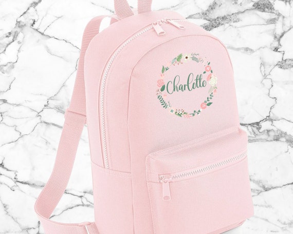 Gepersonaliseerde schooltas met naam bloempatroon
