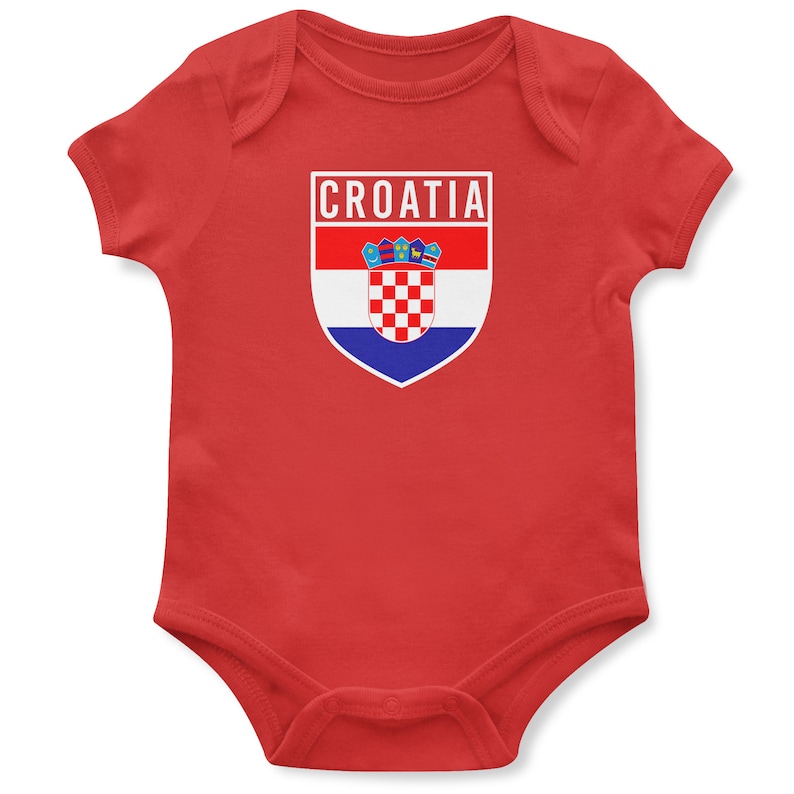May include: Red baby onesie with a white shield featuring the Croatian flag and the word "CROATIA" above it.