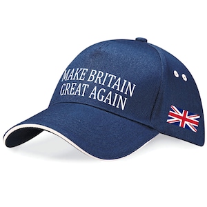 May include: A navy blue baseball cap featuring the slogan "MAKE BRITAIN GREAT AGAIN" in white lettering. The cap has a white trim and a Union Jack flag on the side.