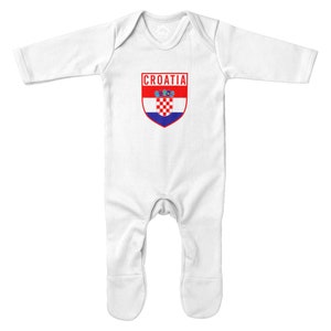 May include: White baby onesie with long sleeves and snaps at the crotch. The onesie has a red and blue Croatian flag with the word "CROATIA" printed above it.