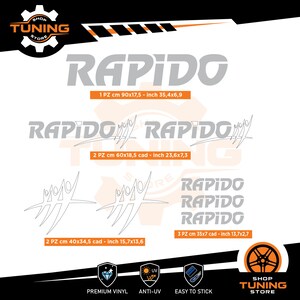 Könnte beinhalten: Eine Auswahl an grauen RAPIDO Vinyl-Aufklebern in verschiedenen Größen, darunter einer mit den Maßen 90 x 17,5 cm. Das Bild zeigt auch das Shop Tuning Store Logo und Symbole für Premium-Vinyl, UV-Schutz und einfache Anwendung.