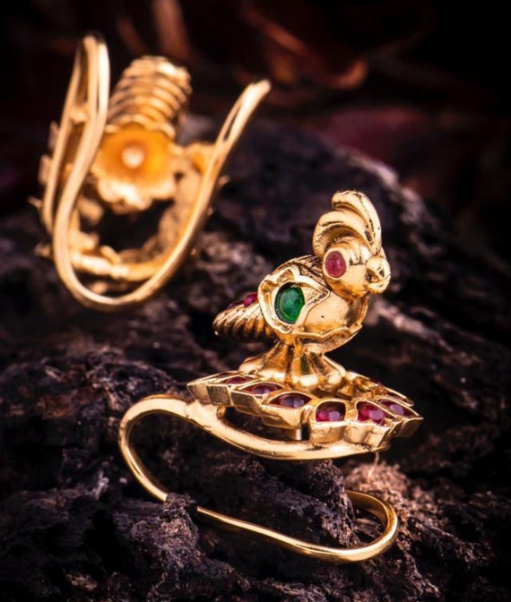Gold peacock finger clearance ring