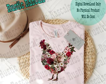 May include: A pink t-shirt with a floral design of a chicken. The design is made up of pink, red, and white flowers. The shirt is on a woven wicker surface with a brown hat.