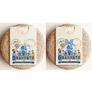 May include: Two beige t-shirts with a graphic design featuring the Cinderella Castle, Mickey Mouse, Minnie Mouse, and other Disney characters. The text "2025 GRADUATE FROM THE TASSEL TO THE CASTLE" is printed on the shirts.