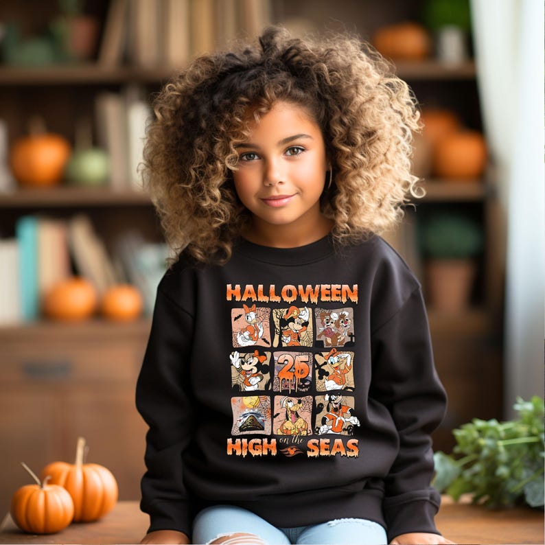May include: Black sweatshirt with a colorful Halloween graphic featuring Mickey Mouse and other Disney characters. The graphic says "Halloween on the High Seas".