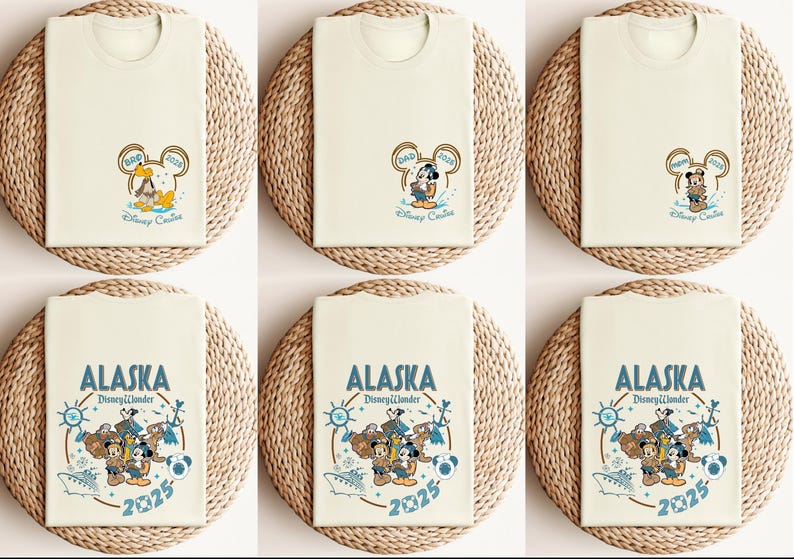 May include: Cream-colored t-shirts with Disney character graphics. One design features Mickey Mouse with "DAD 2023" in a Mickey Mouse ear frame. Another design says "ALASKA Disney Wonder 2025" with Mickey, Donald, and Goofy.