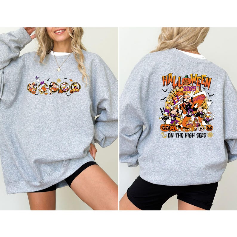 May include: A heather gray sweatshirt with a Halloween-themed graphic on the front and back. The front features cartoon characters in a circular design, while the back displays the text "Halloween 2025" and "On The High Seas" with pumpkins and other Halloween elements.