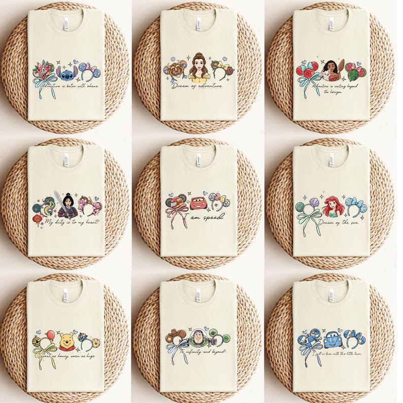 May include: Nine cream-coloured t-shirts with cartoon character designs. Each shirt features a different character or theme, including Stitch, Belle, Moana, Mulan, Cars, Ariel, Winnie the Pooh, Buzz Lightyear, and Lightning McQueen. Each shirt has a quote.