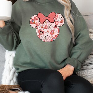 May include: A green sweatshirt with a pink and red Mickey Mouse head design. The design features hearts, Mickey Mouse and Minnie Mouse characters, and the text "Crazy 4 You".