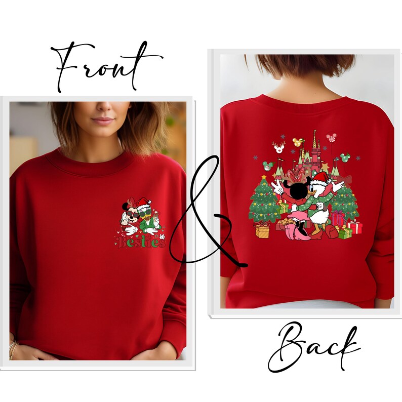 May include: Red sweatshirt featuring a Christmas-themed graphic of Mickey and Minnie Mouse on the front and back. The front design includes the word "Besties". The back design shows Donald Duck and Daisy Duck with a castle and Christmas trees.