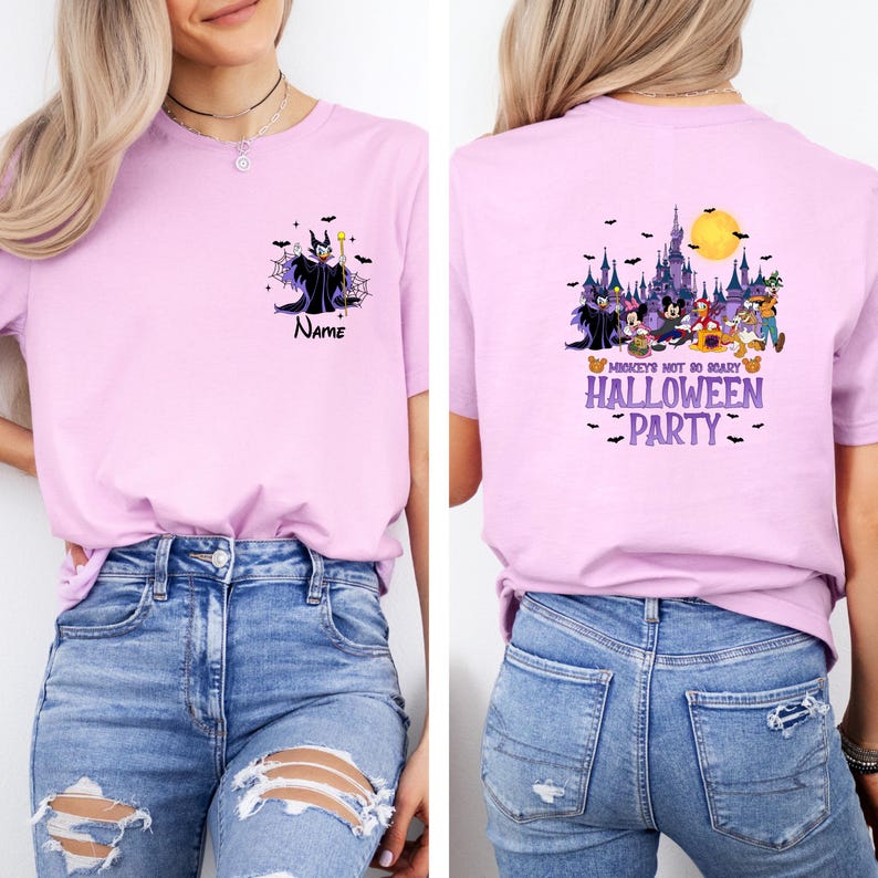 May include: A light pink t-shirt featuring a front and back design. The front displays a cartoon of a character with the text "Name". The back features a Halloween-themed design with the text "Mickey's Not So Scary Halloween Party".