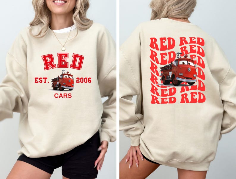 May include: A cream colored sweatshirt with a red graphic of a fire truck and the text "RED EST. 2006 CARS". The back of the sweatshirt has the word "RED" repeated in a retro style.