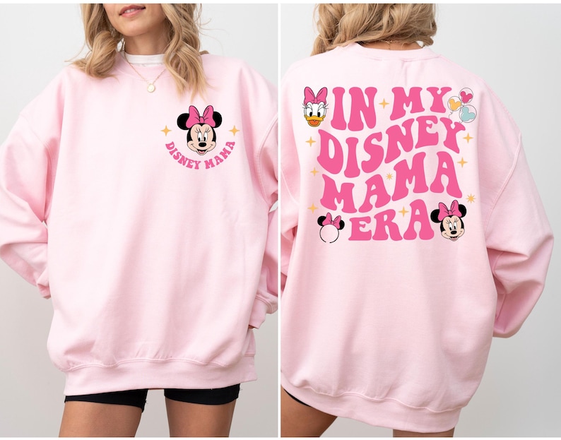 May include: Pink sweatshirt with a graphic of Minnie Mouse and the text "Disney Mama" on the front and the text "In My Disney Mama Era" on the back.