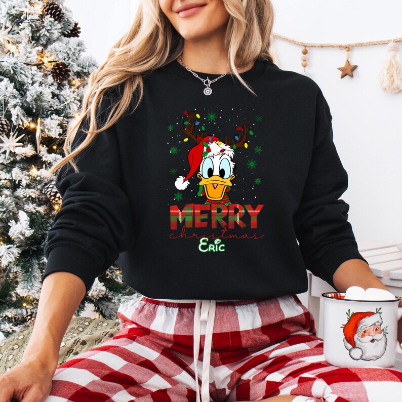 May include: A white ceramic mug with a black handle and the text "But First, Coffee" in a bold, black font. The mug is set against a neutral background, highlighting its simple design.