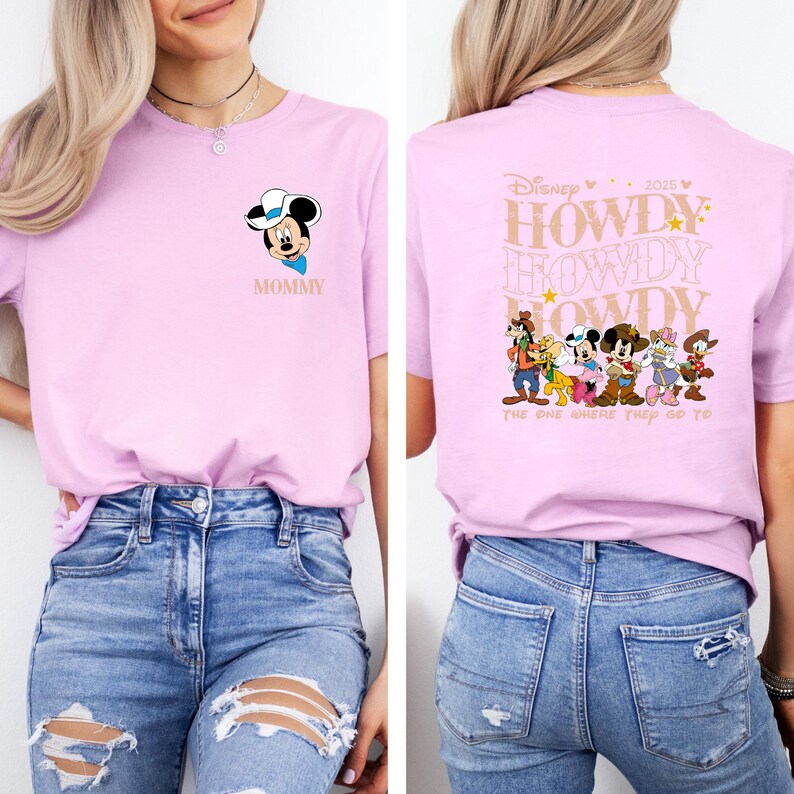 May include: A light pink t-shirt featuring a Mickey Mouse graphic with the word "Mommy" below. The back of the shirt has a "Howdy" design with Disney characters. The text "The One Where They Go To" is also printed on the back.