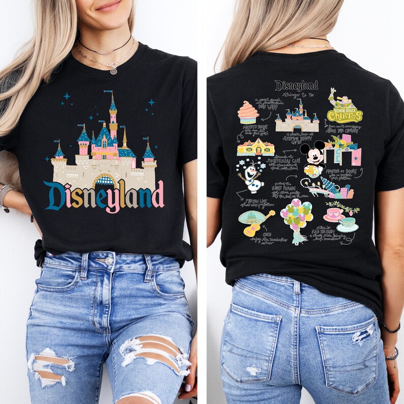 May include: Black t-shirt featuring a colourful illustration of Disneyland castle on the front and a map of Disneyland attractions on the back. The text "Disneyland" is printed below the castle.