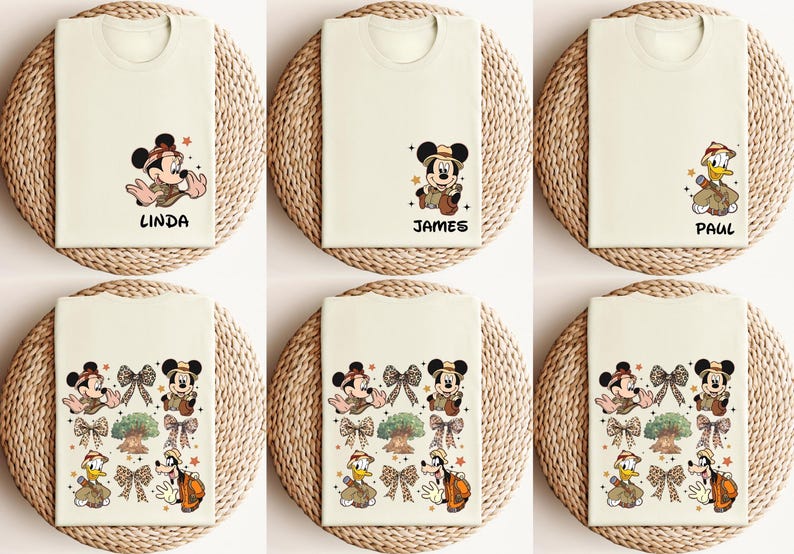 May include: Six white t-shirts with different Disney character designs. The designs include Mickey Mouse, Donald Duck, and Goofy. The shirts are all in a safari theme and have the names Linda, James, and Paul printed on them.